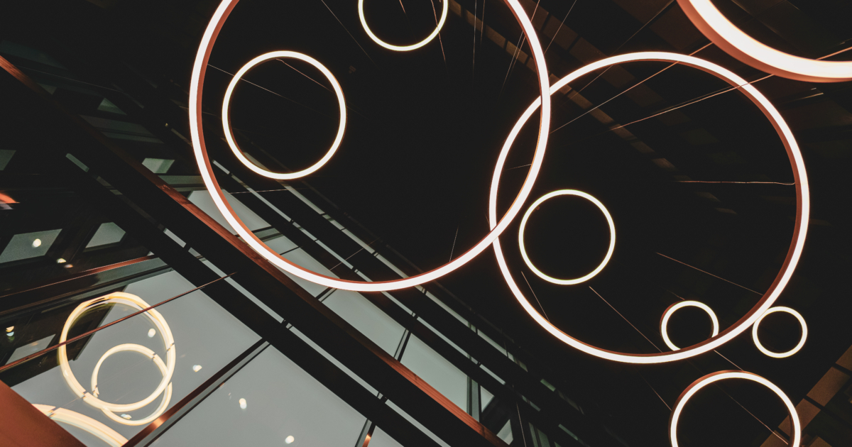 Light,Rings,Hanging,From,The,Building,Ceiling,,Dark,Architectural,Concept